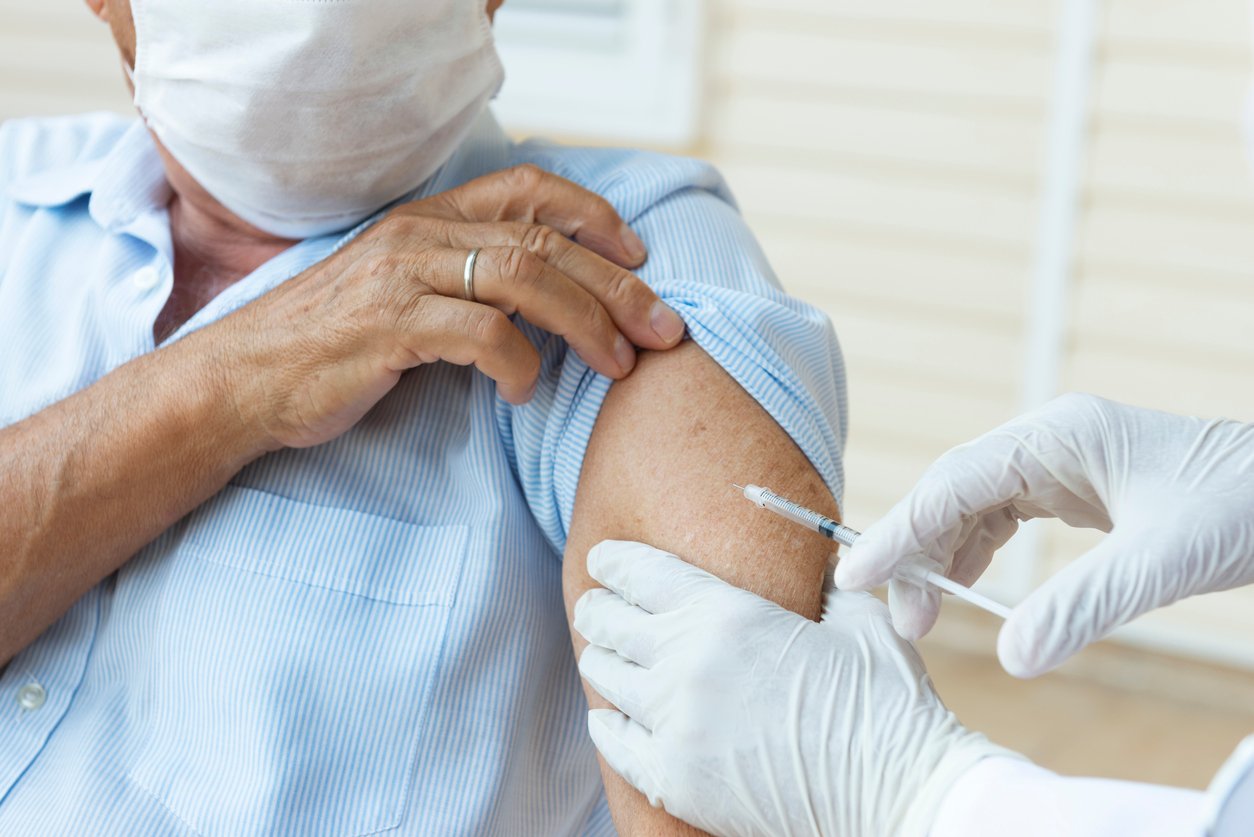 Man receiving a vaccine during flu season
